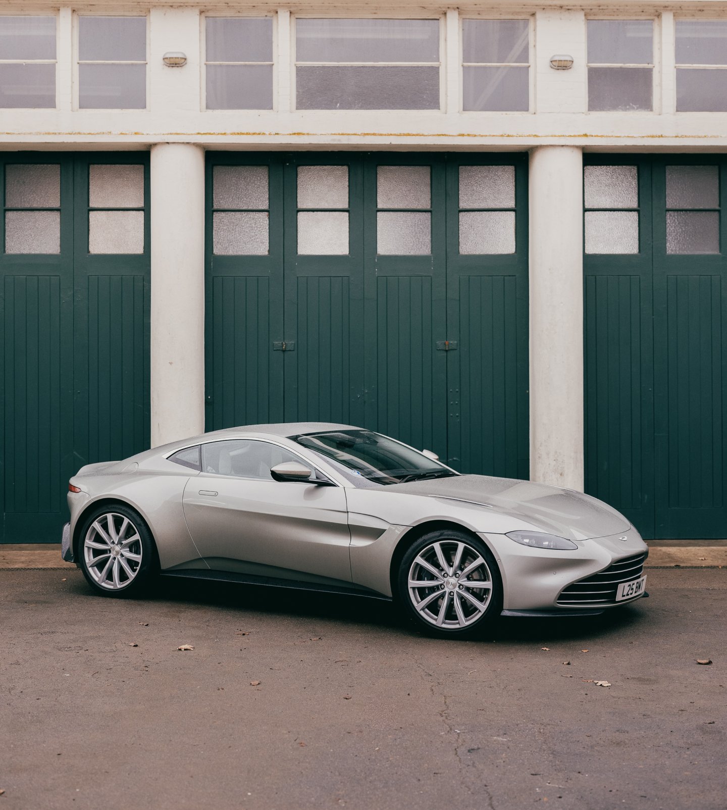A side view of a silver aston martin Aston Martin V8 Vantage 2019 model